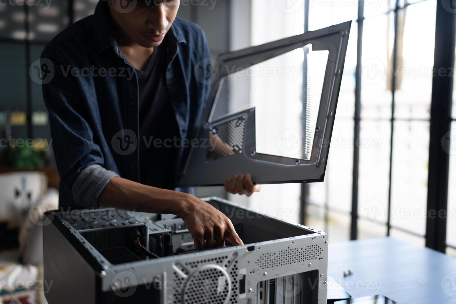 IT Engineer man is working on a computer case photo