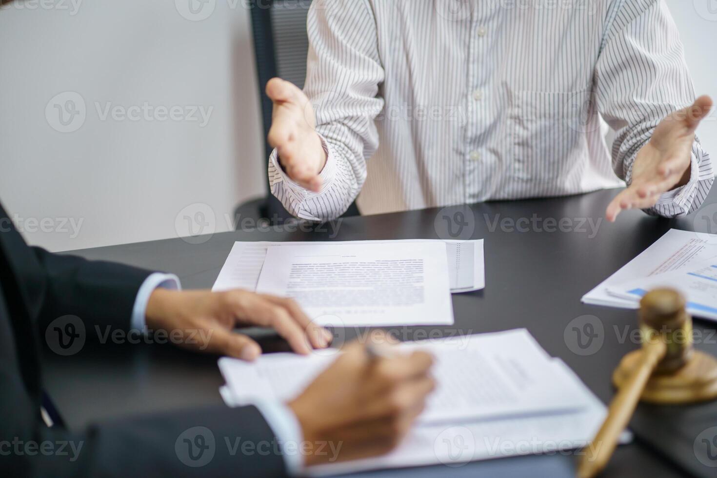Lawyer Legal counsel present to the client a signed contract with gavel and legal law. justice and lawyer Business partnership meeting photo