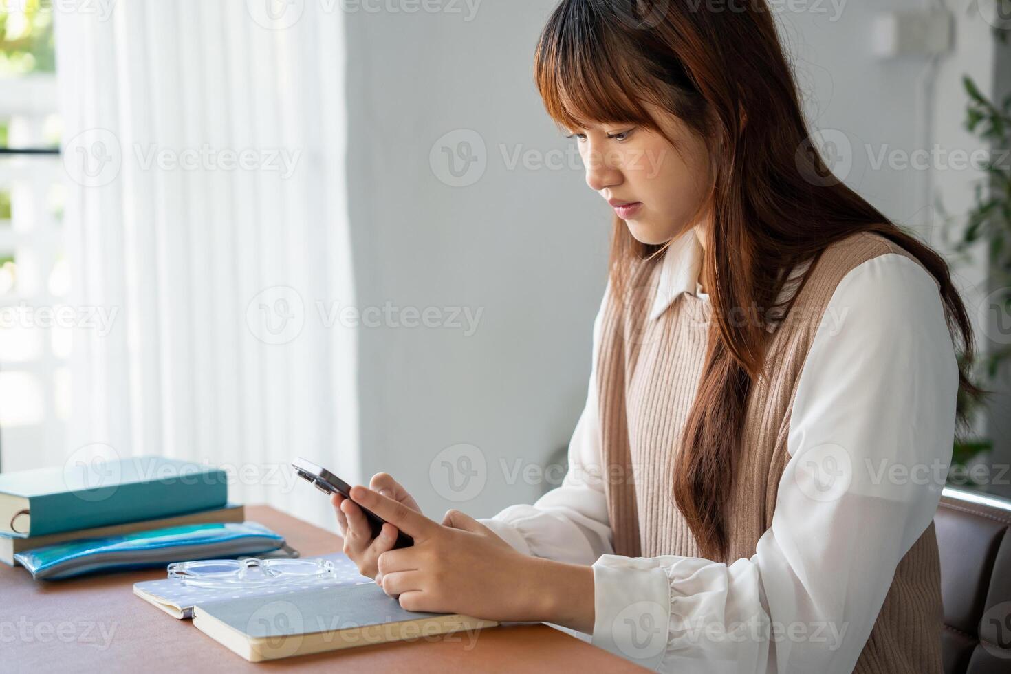 Student woman use smart phone in dorm room college mobile addict spending time checking news technology e-commerce. photo