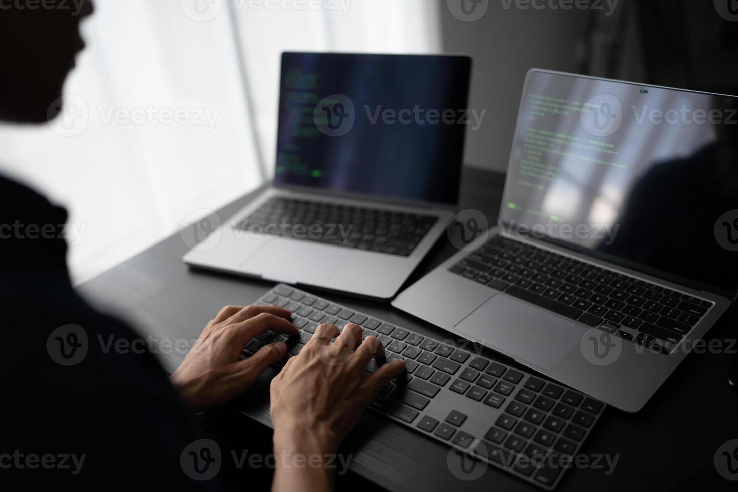 software engineer coding on a laptop computer photo