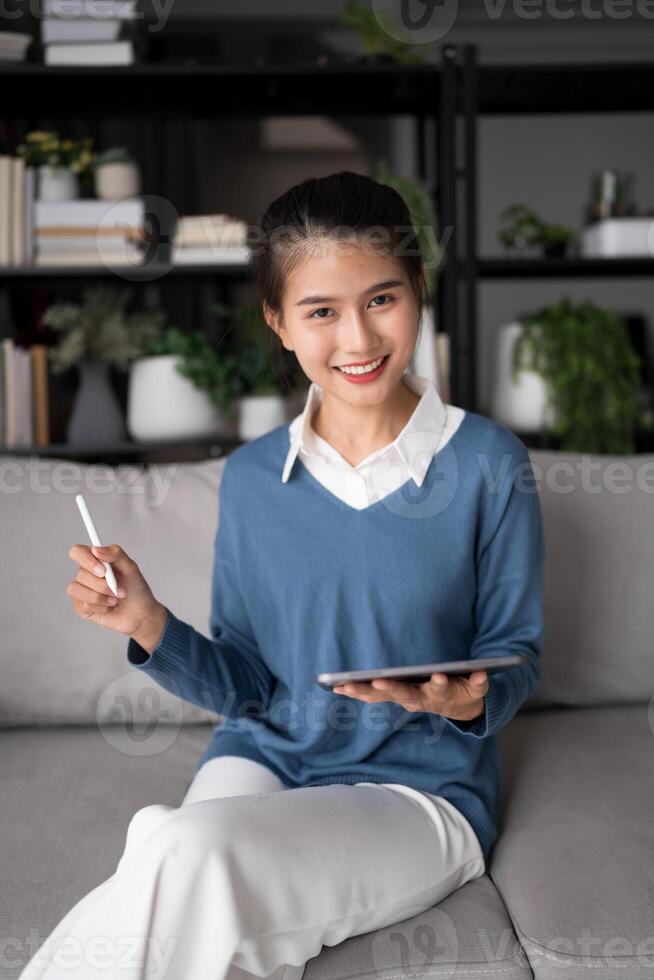 Asian woman Graphic designer working on digital tablet. artist drawing on graphic tablet female Artist Creative Designer sketch graphic drawing creative studying work on tablet at home photo