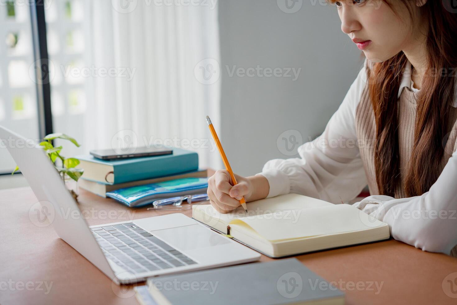 student girl using laptop to study student engaged in online learning at college. photo