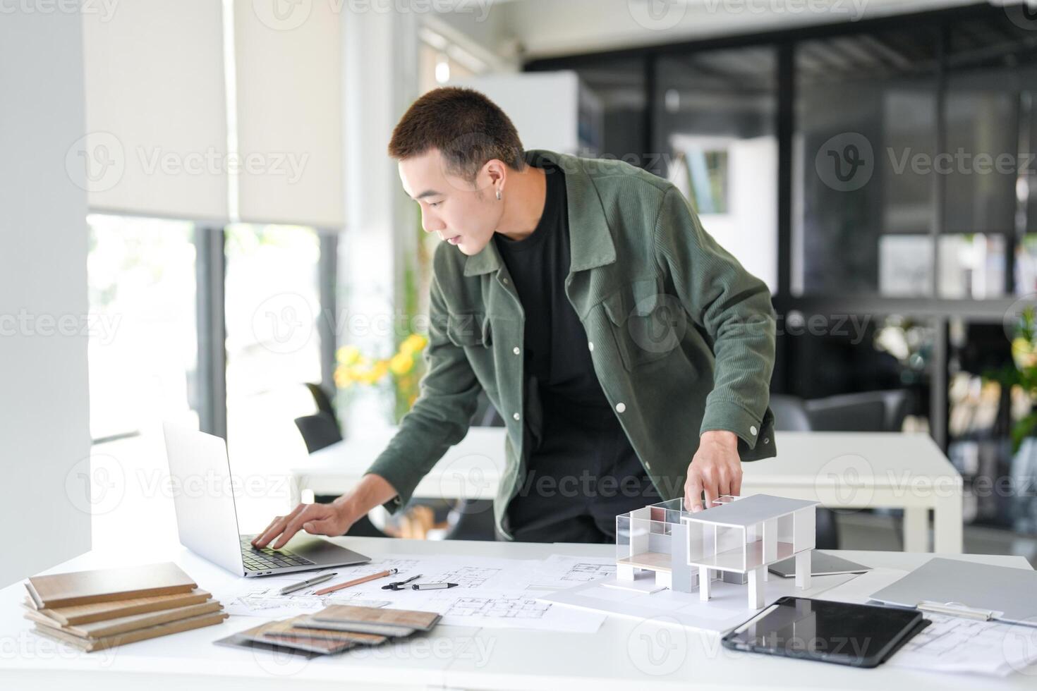 Architecture interior working on a laptop in an office photo