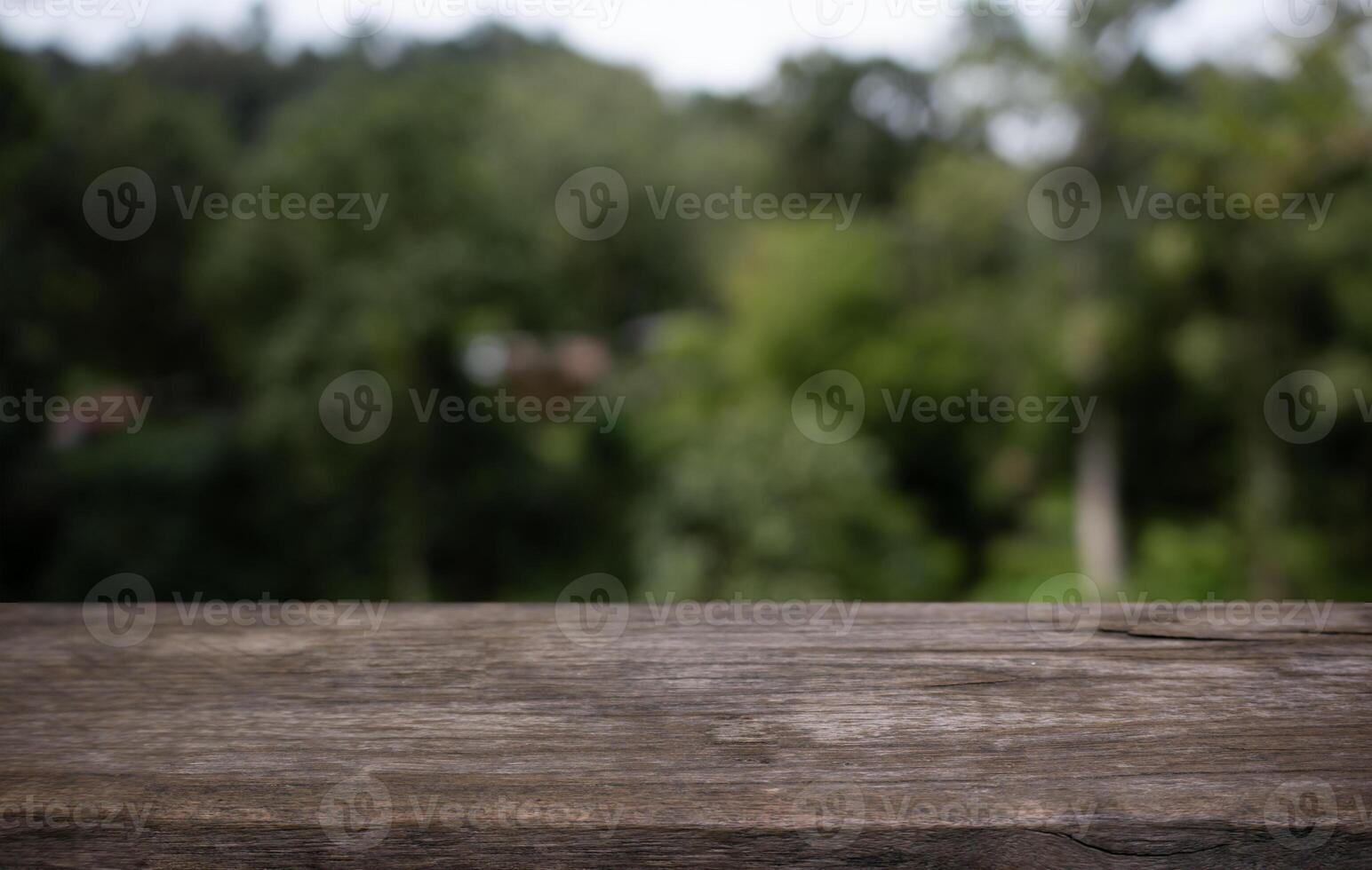 a wooden table top with a blurry background photo