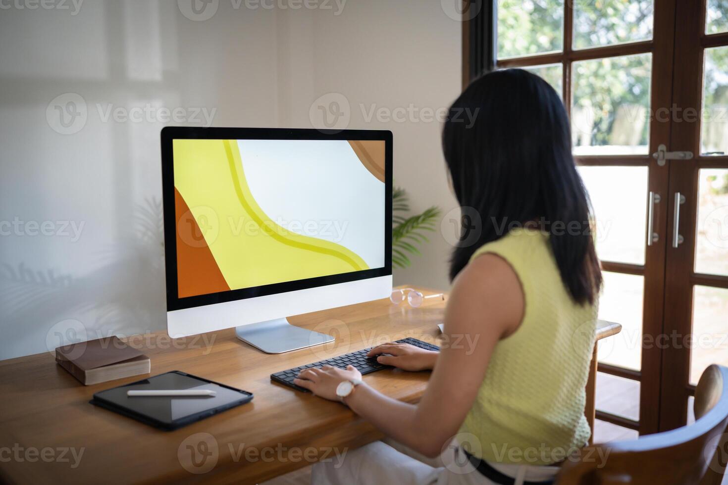 Graphic designer working on digital tablet and computer. Designer Asian Woman artist drawing on graphic tablet Artist Creative Designer sketch graphic drawing creative in office. photo