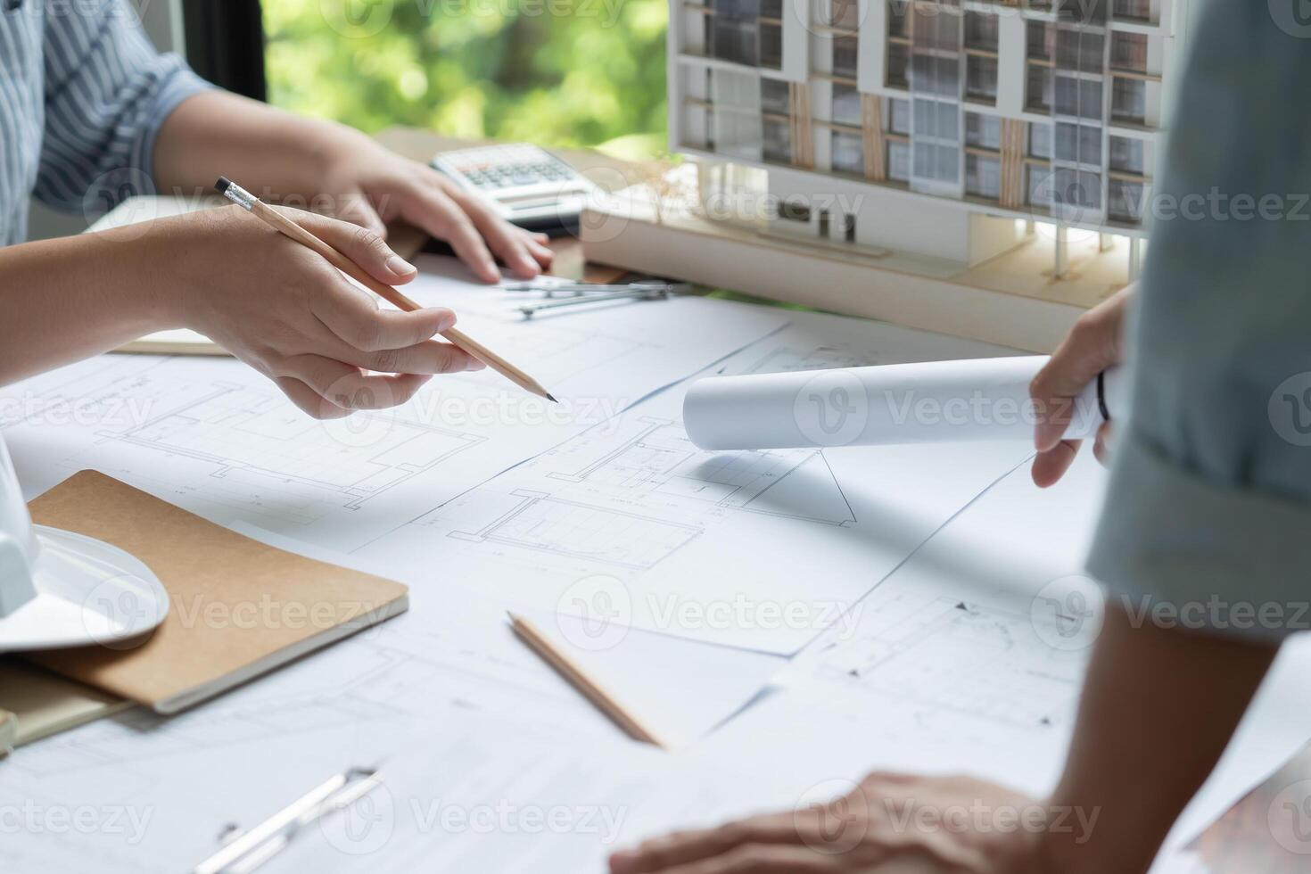 Architecture drawing on architectural working on a project with blueprints photo