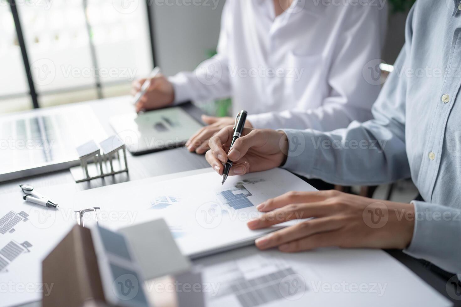 two engineers working on a project at a table with solar energy photo