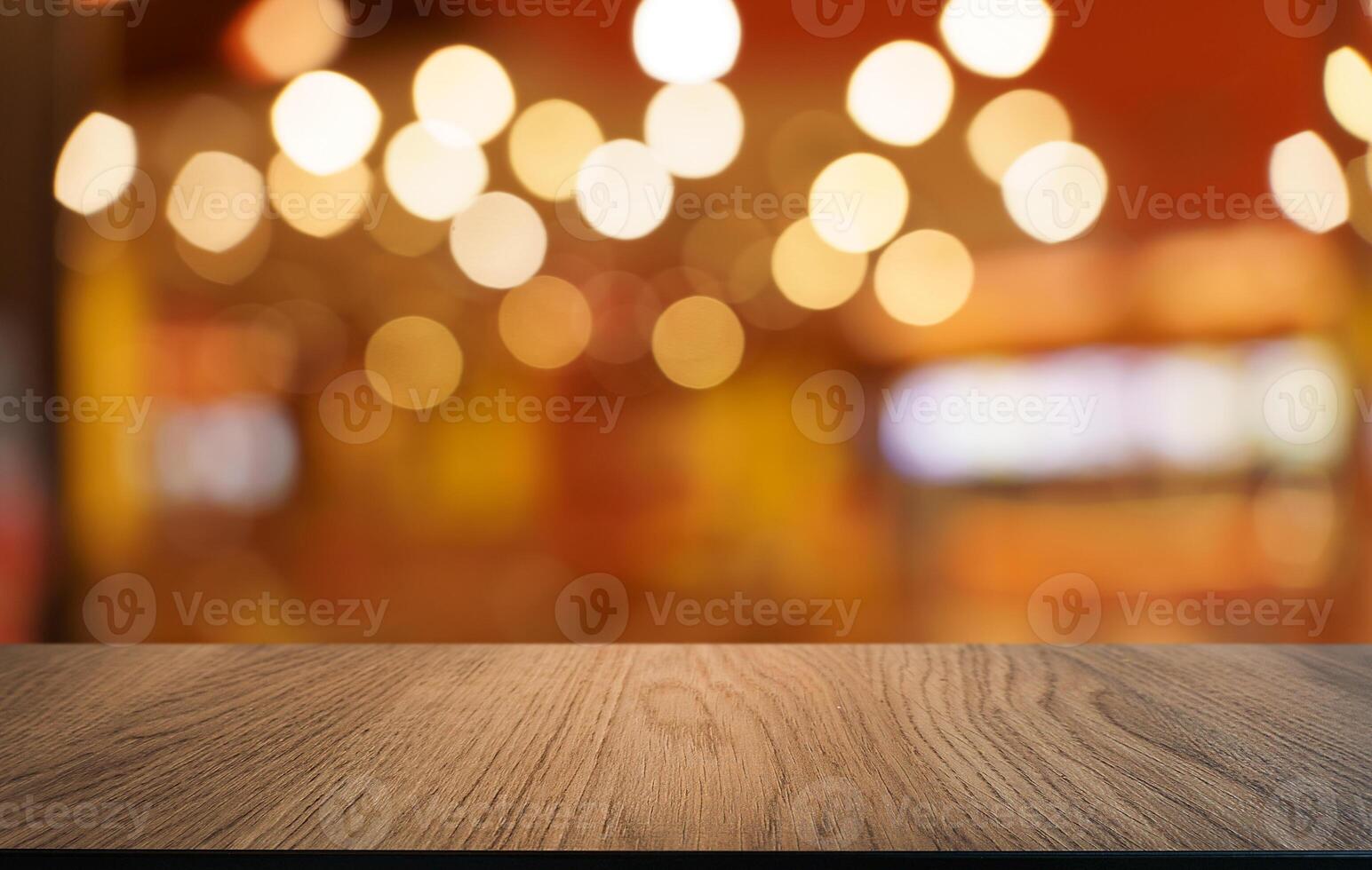 empty wooden table top over blurred bokeh lights photo