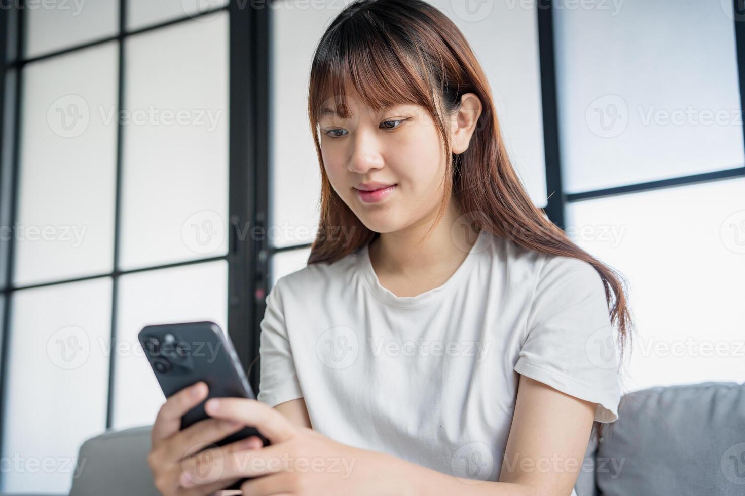 Asian woman using smartphone texting message information. photo