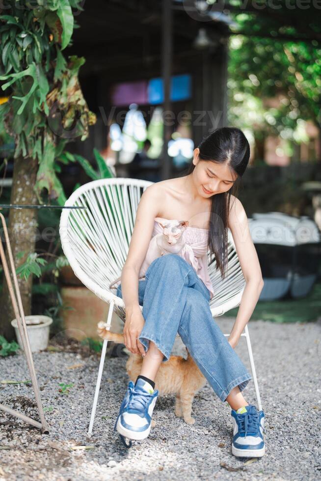 Smiling Beautiful asian young woman with Egyptian Sphynx cat Canadian Sphinx breed cat. photo