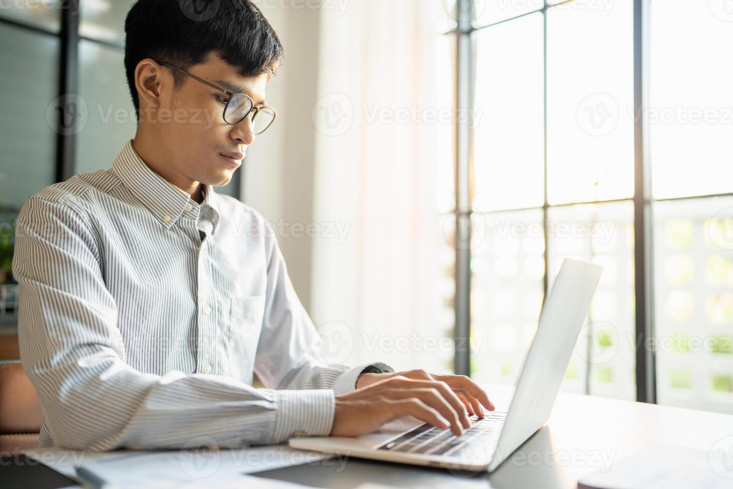 Business man working using laptop computer Hands typing keyboard. Professional investor working start up project. business planning in office, Technology business photo
