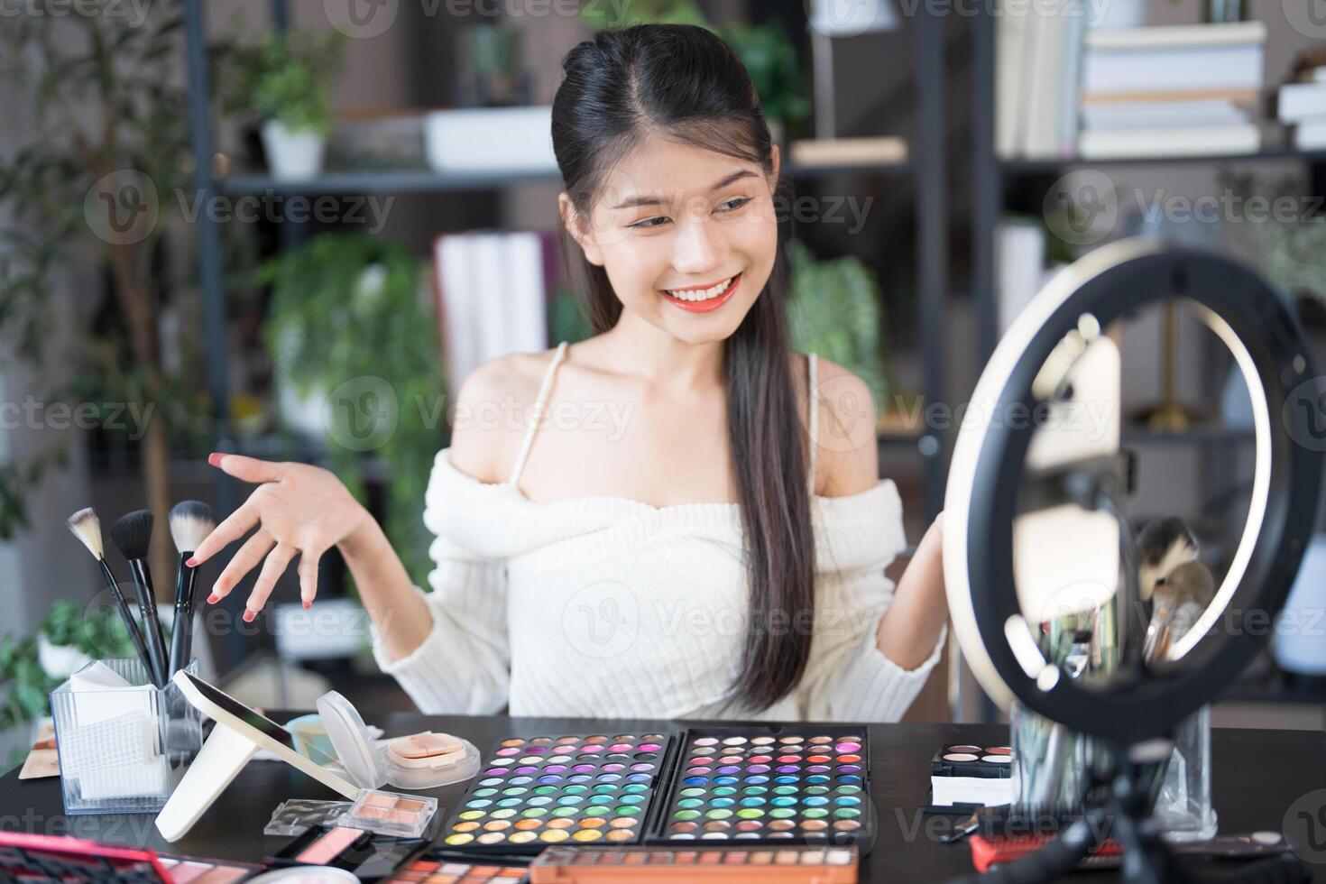 Beauty influencer girl Using Social Media for live streaming on Smartphone online audience like and subscribe to her channel. Like, Follower, Comment photo