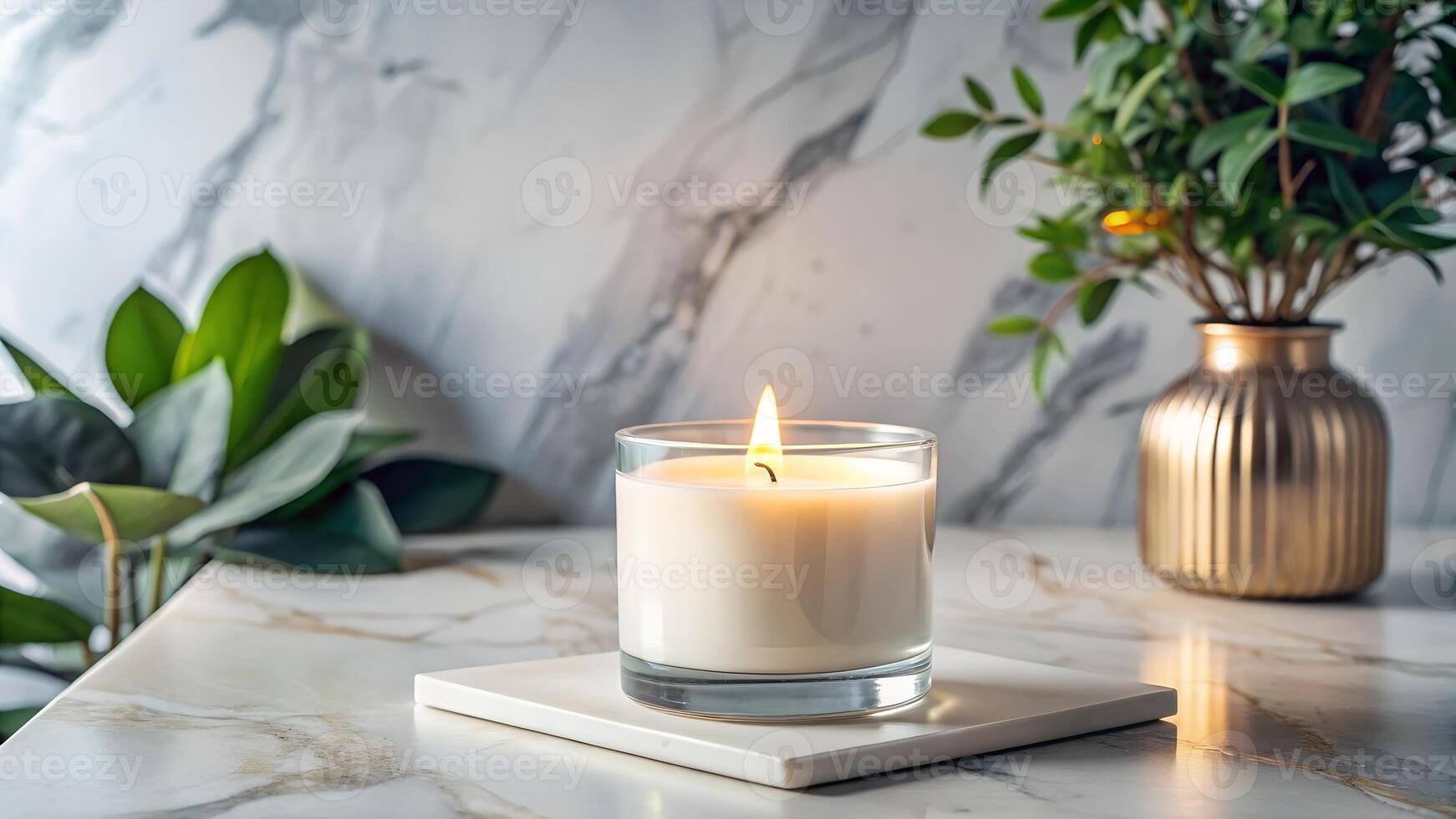 A candle is sitting on a marble counter photo