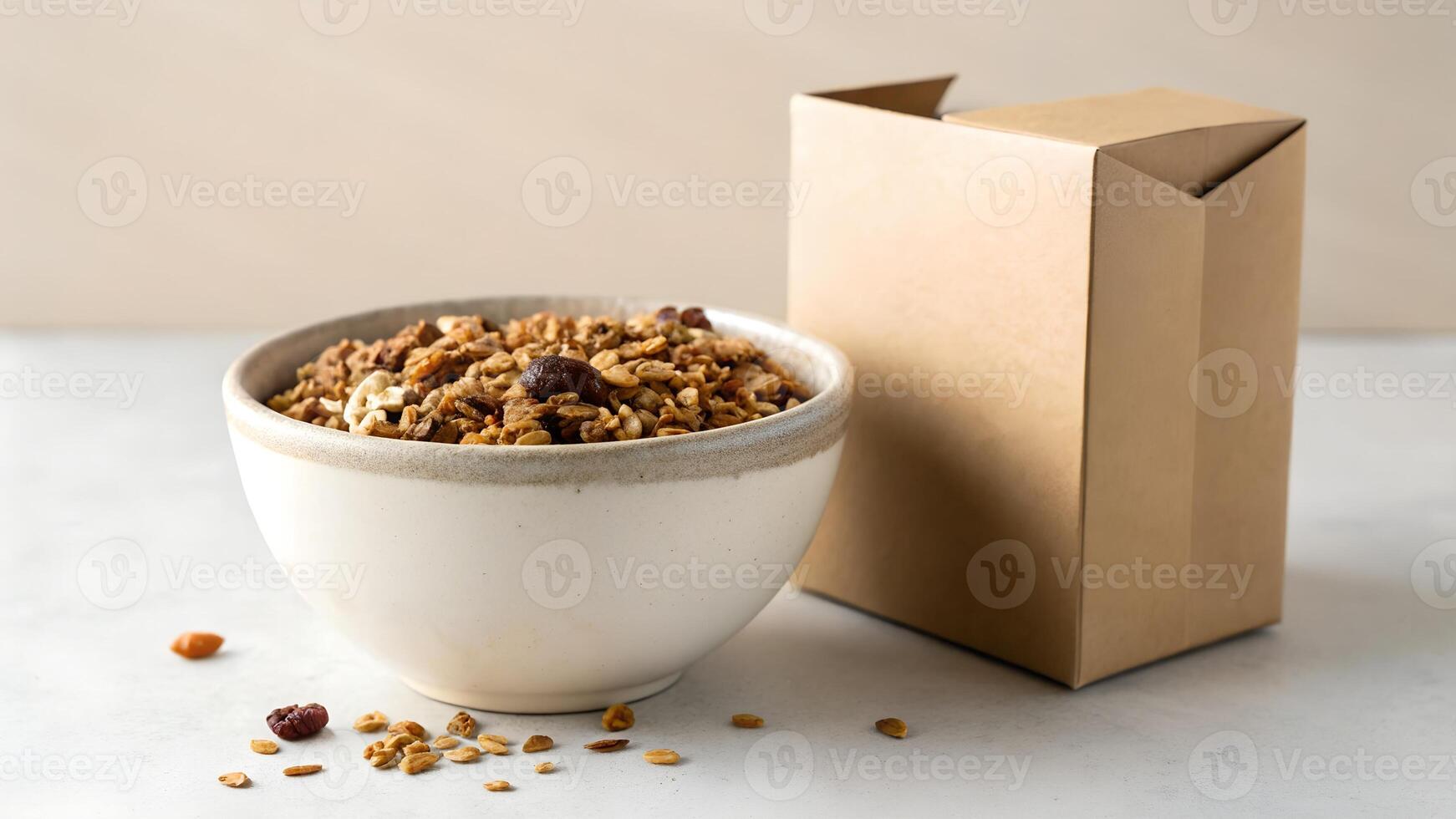 Granola in a bowl next to a box photo
