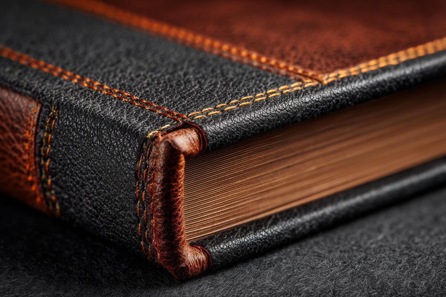 Close up of a leather book on a black background photo