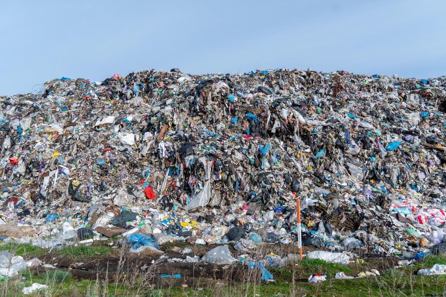 Massive Landfill Heap Full of Mixed Waste, Environmental Pollution Accumulation, Garbage Disposal Site Overflowing with Trash photo