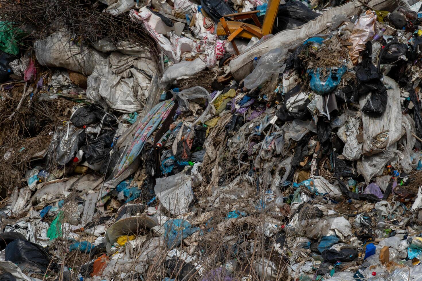 Extensive Accumulation of Discarded Waste Materials Forming a Large Pile, Depicting Landfill Crisis and Environmental Pollution photo