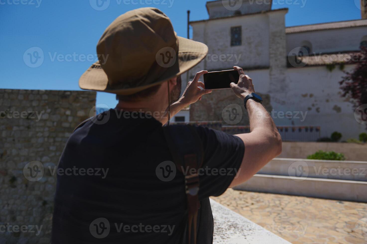 Tourist Captures Historic Architecture on a Sunny Day Exploring a Scenic Location photo
