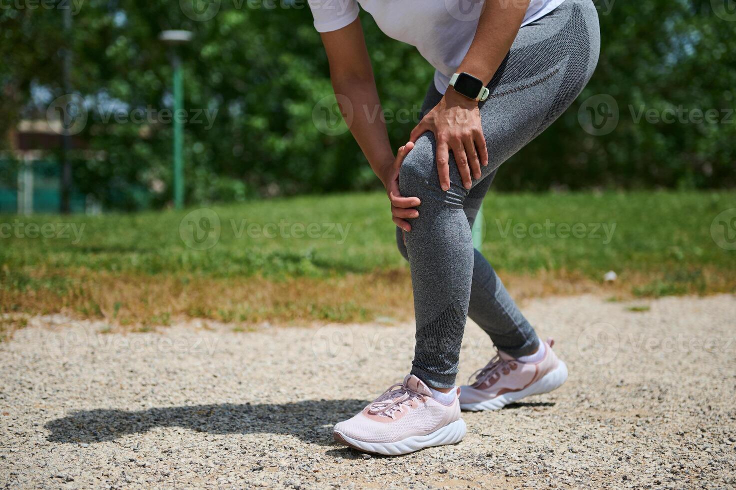 Athlete Experiencing Leg Pain Outdoors During Exercise Routine photo
