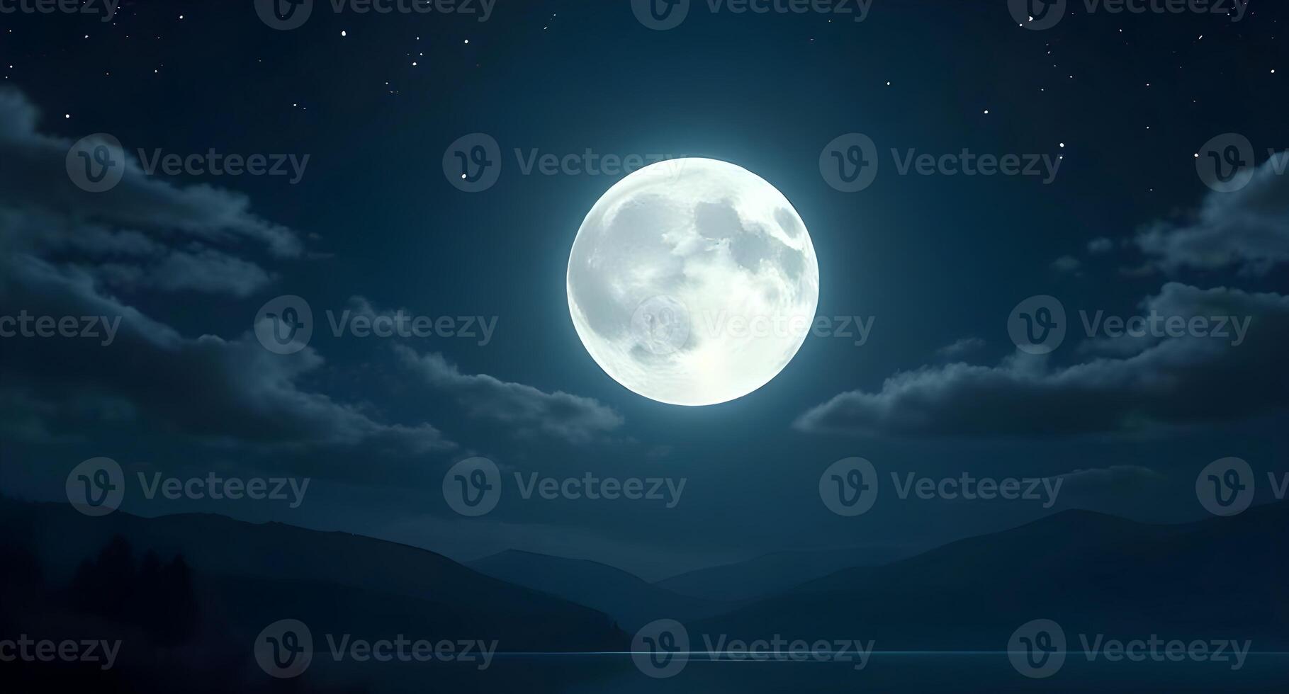 A full moon is seen over a lake at night photo