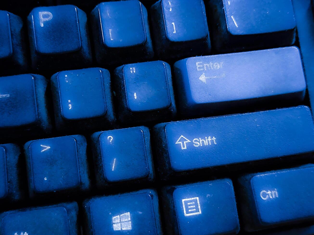 Close-up View of a Dusty Blue Computer Keyboard photo