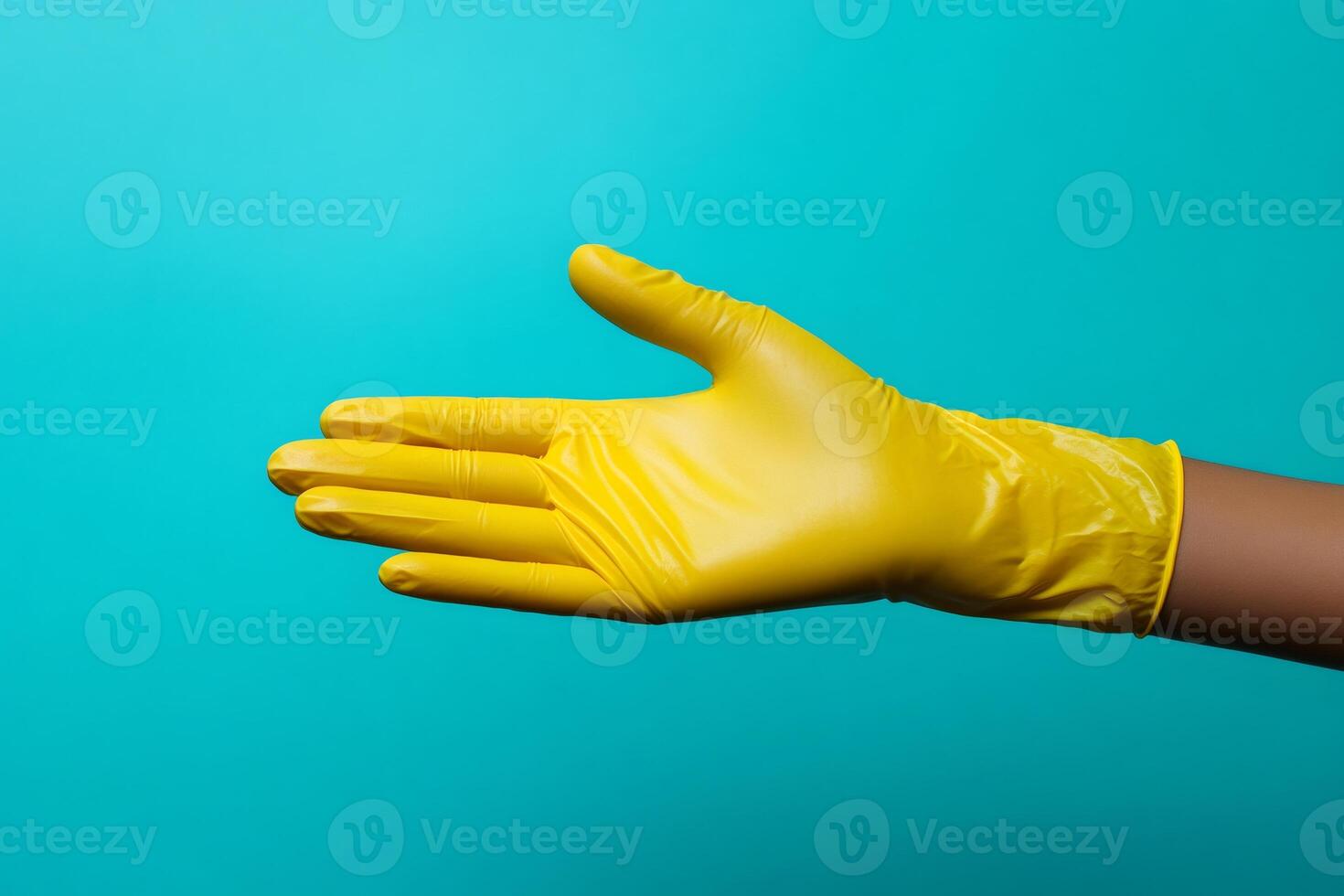 Hand with yellow cleaning glove making welcome gesture on a turquoise background photo