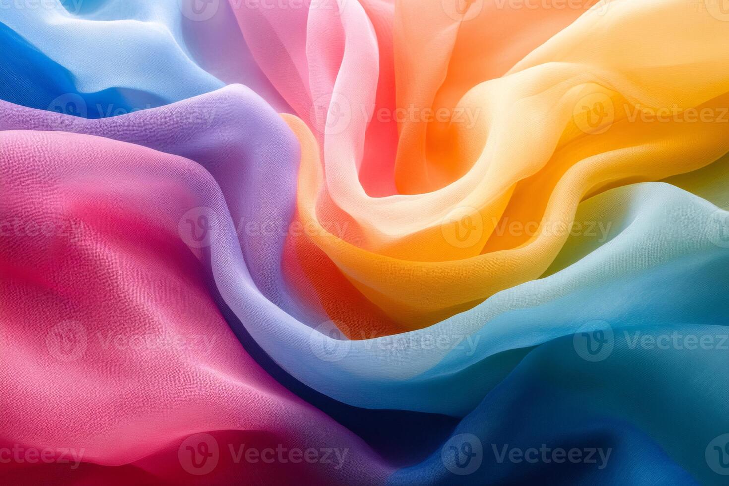 Multicolored chiffon fabric flowing creating a beautiful rainbow pattern photo