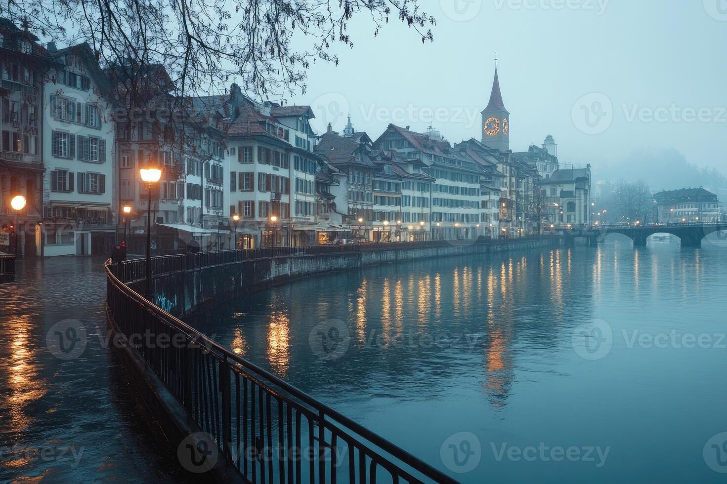 Cityscape of zurich reflecting on limmat river at twilight photo