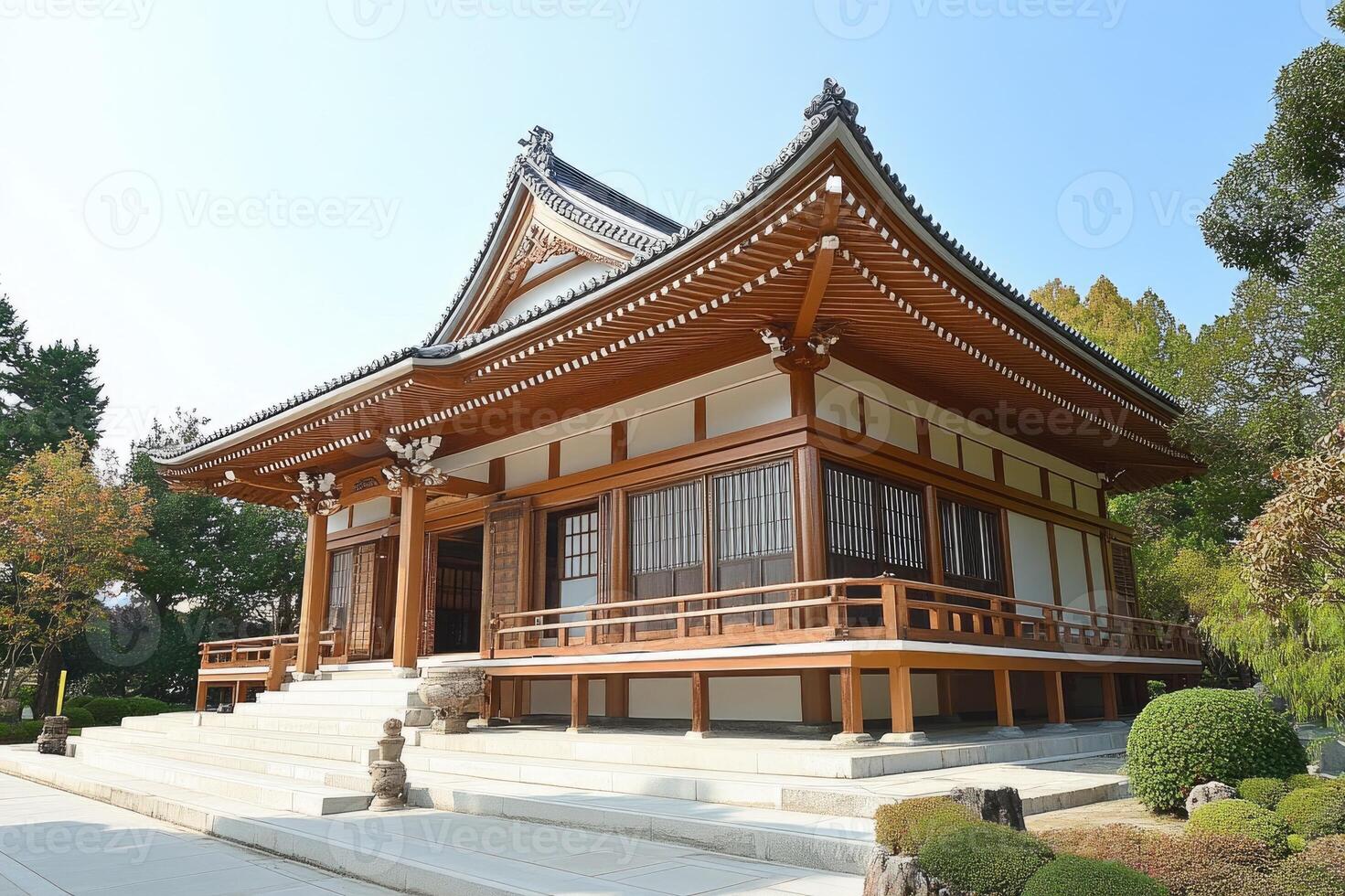 Traditional japanese buddhist temple building surrounded by trees photo