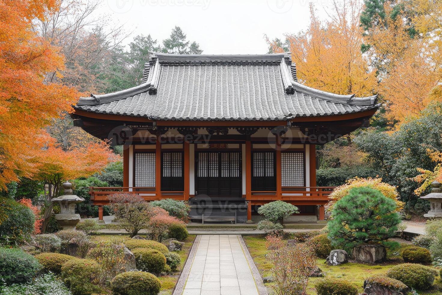 Traditional japanese temple building standing in a tranquil garden during autumn photo
