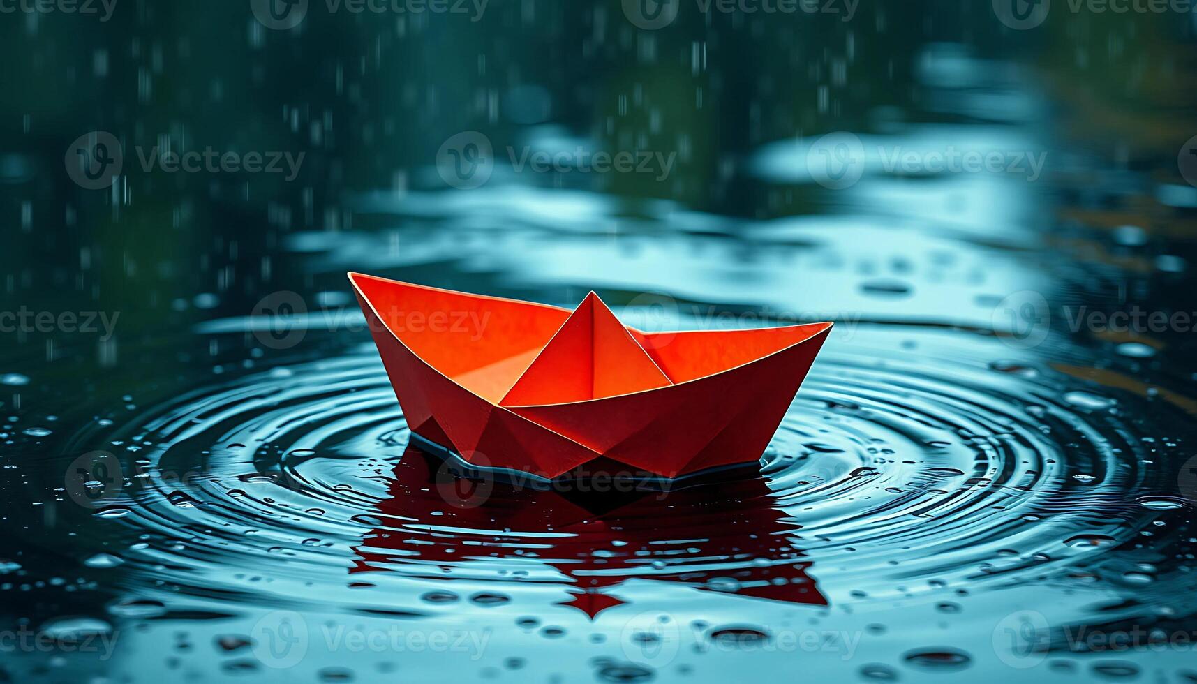 A paper boat floating in the water photo