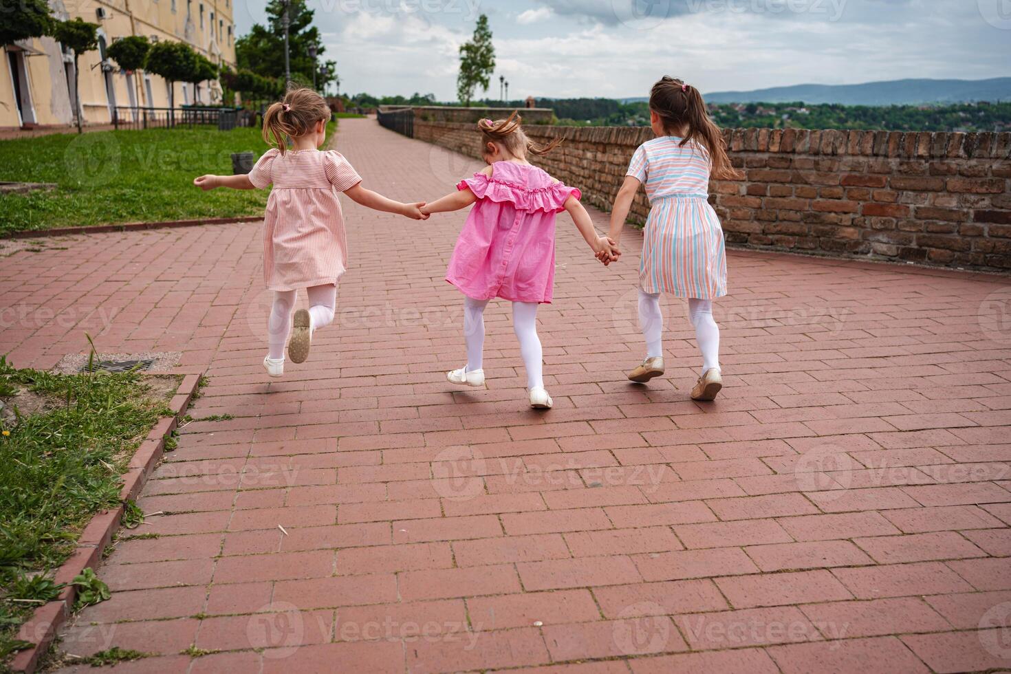 Joyful children exploring Petrovaradin fortress grounds photo