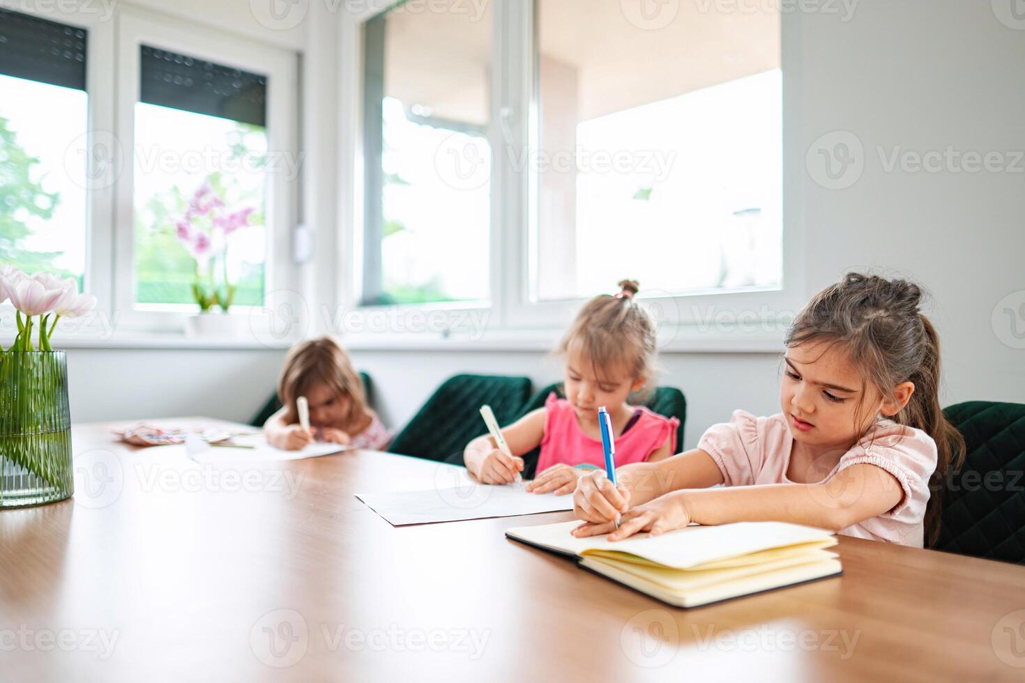 Kids engaged in creative drawing and coloring activities photo
