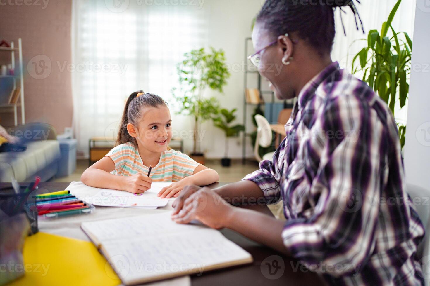 Inspiring moments between a tutor and student in a bright study space photo