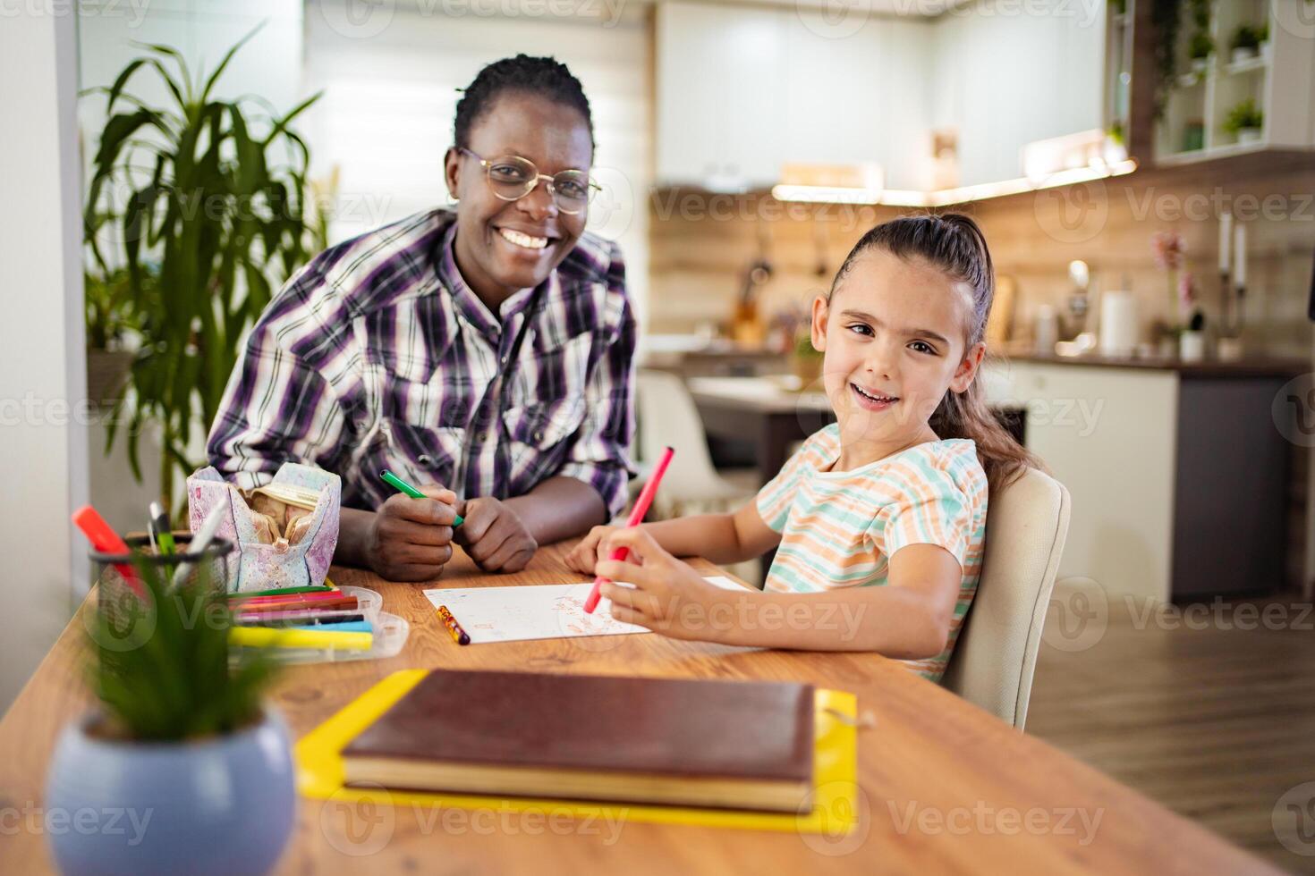 Creative moments between a joyful mentor and a young artist photo