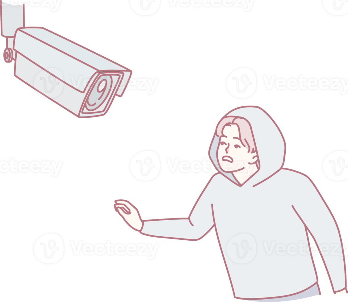 A figure in a hoodie interacts with a surveillance camera, highlighting security and privacy themes. png