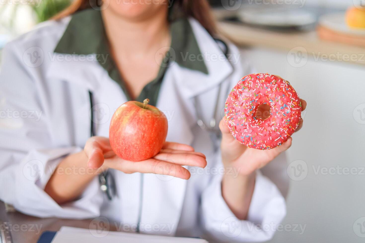 A doctor explains the effect of sweets on human health and the connection with diseases and the benefits of fresh fruits. The concept of dietetics and medical services. photo