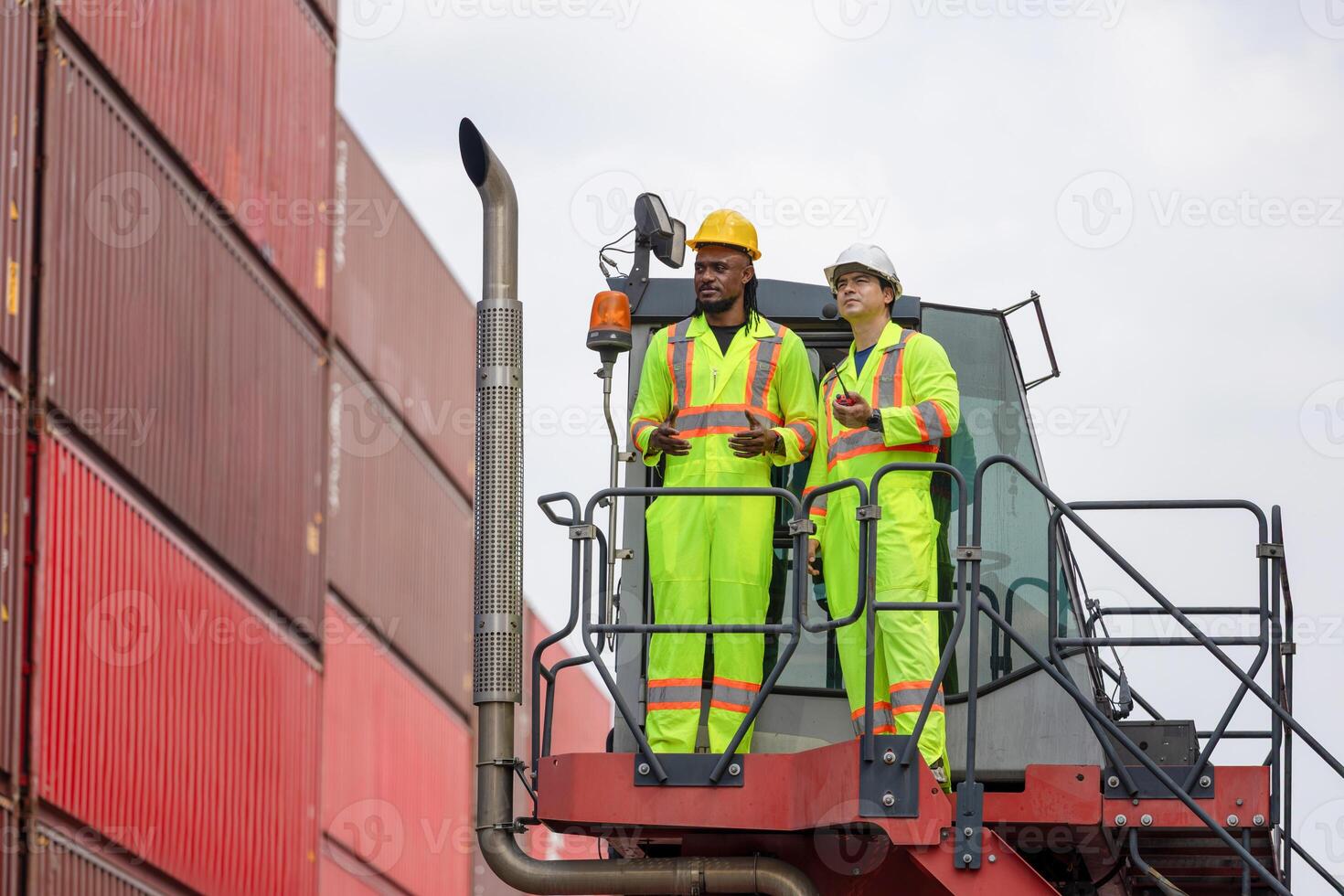 Diverse Team of Engineers Working in Industrial Shipping Yard, Dock Workers Discussing Project on Crane Truck, Foreman Workers Inspecting Cargo Containers at Dockyard photo