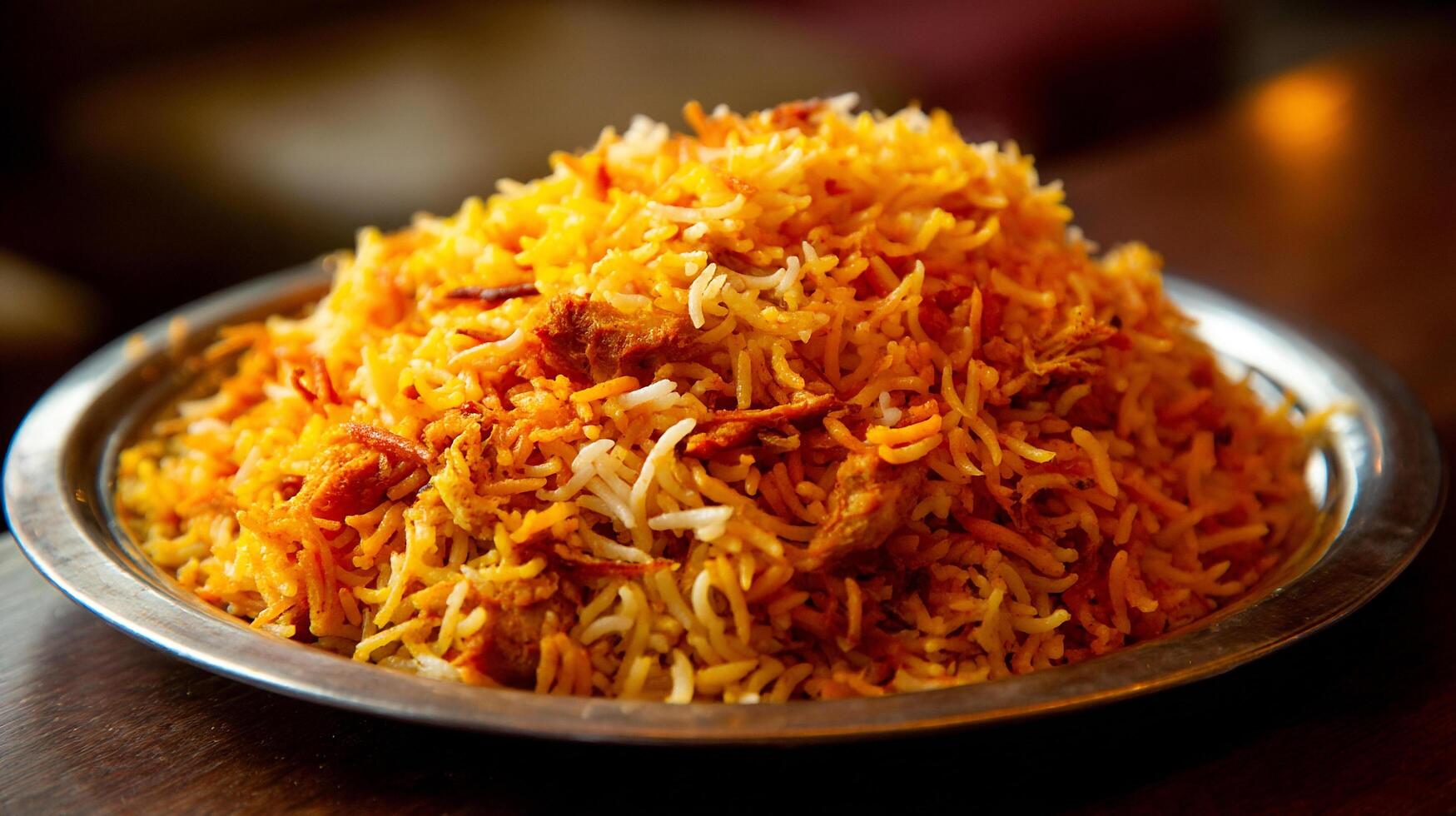 Chicken biryani image with visible grains and golden fried onions photo