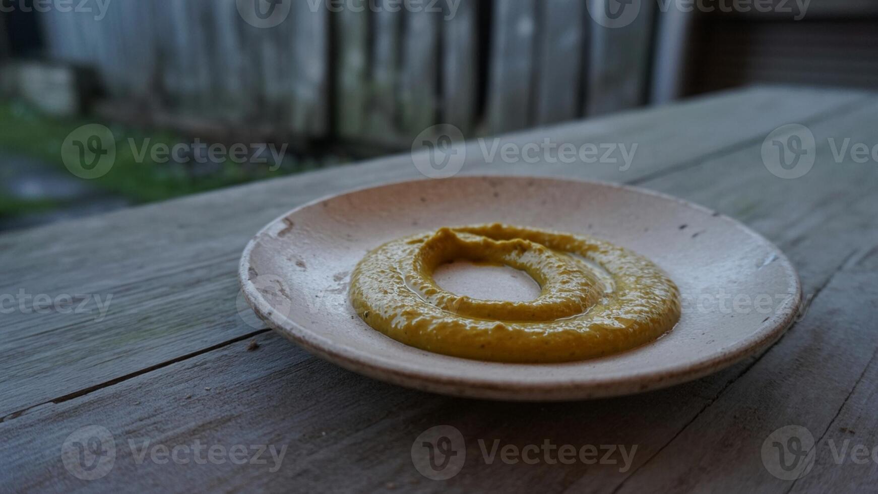 A bowl of mustard photo
