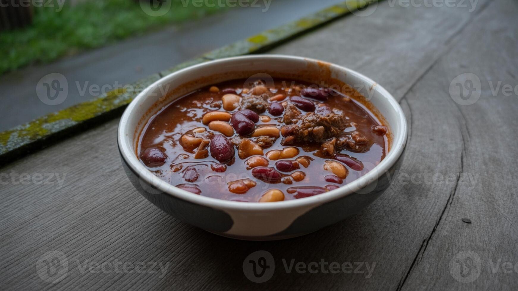 A bowl of chili with beans and meat in it photo