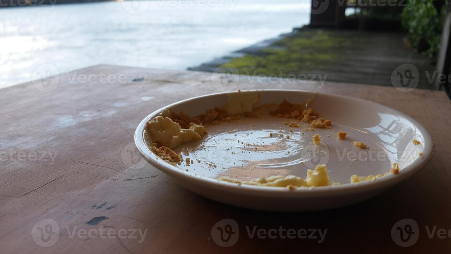 A bowl of butter on a table photo
