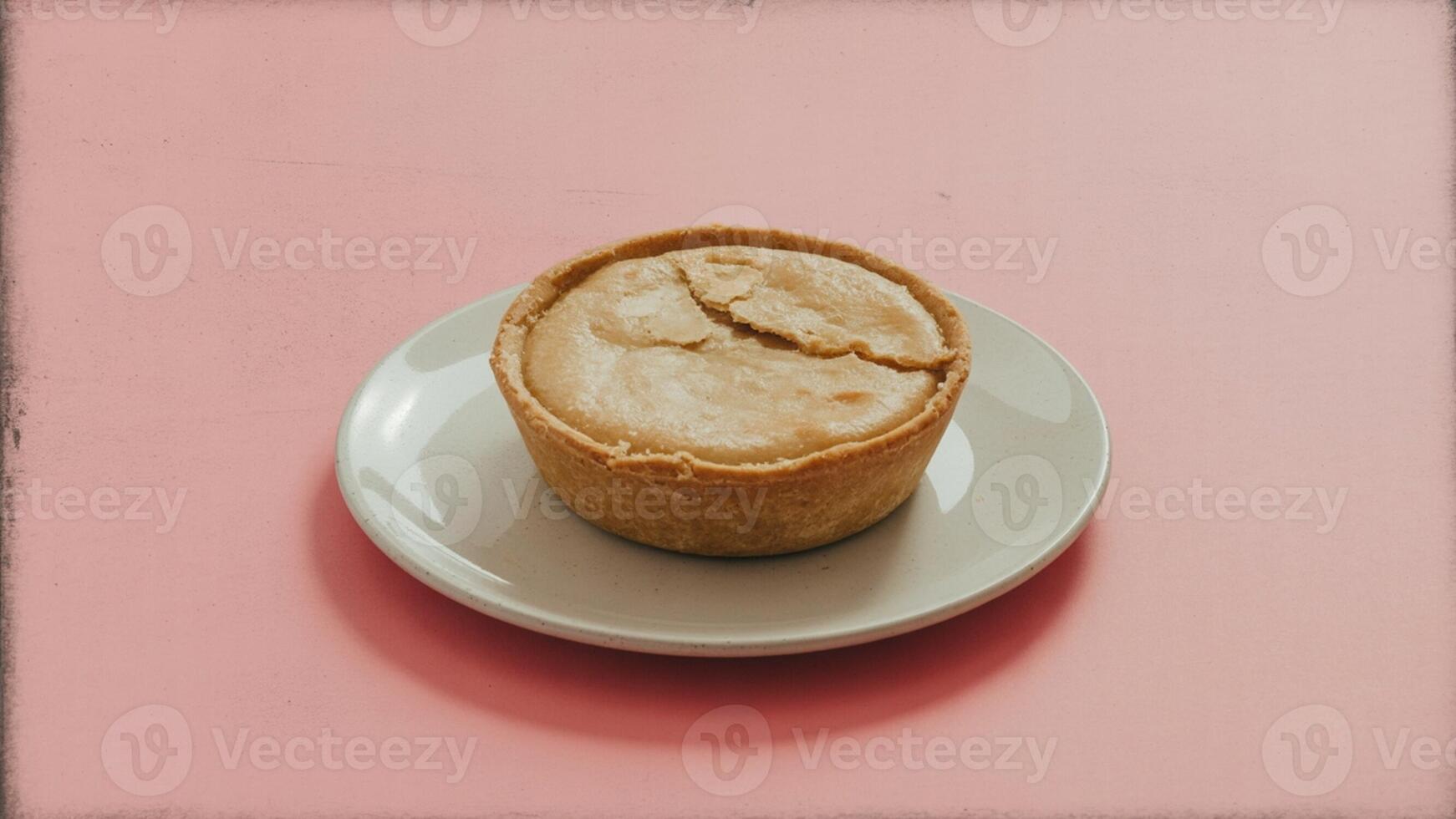A single pie on a white plate centered on a pink background with a simple and clean presentation style photo