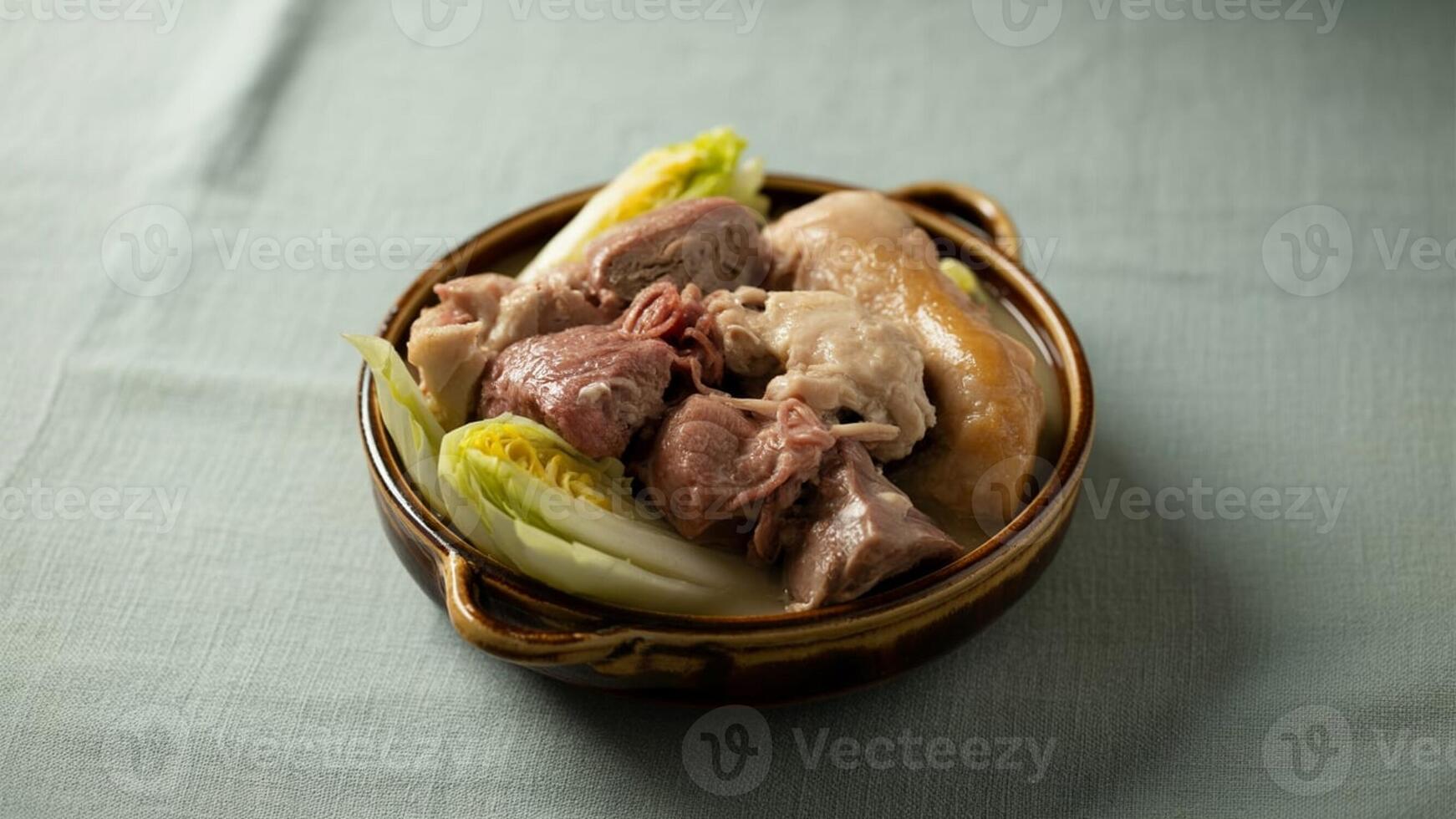 a pla te of pa ppa rdelle pa sta with toma to sa uce a nd pa rmesa n cheese on a wooden ta ble with a fork nea rby photo
