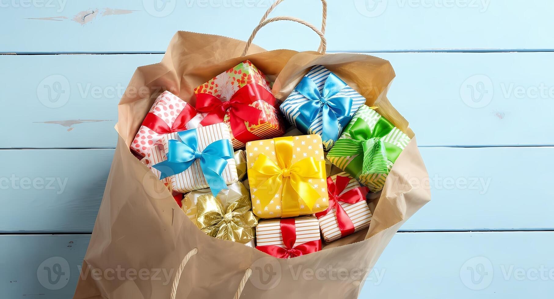 Colorful gift wrapped in paper bag on blue wooden table photo