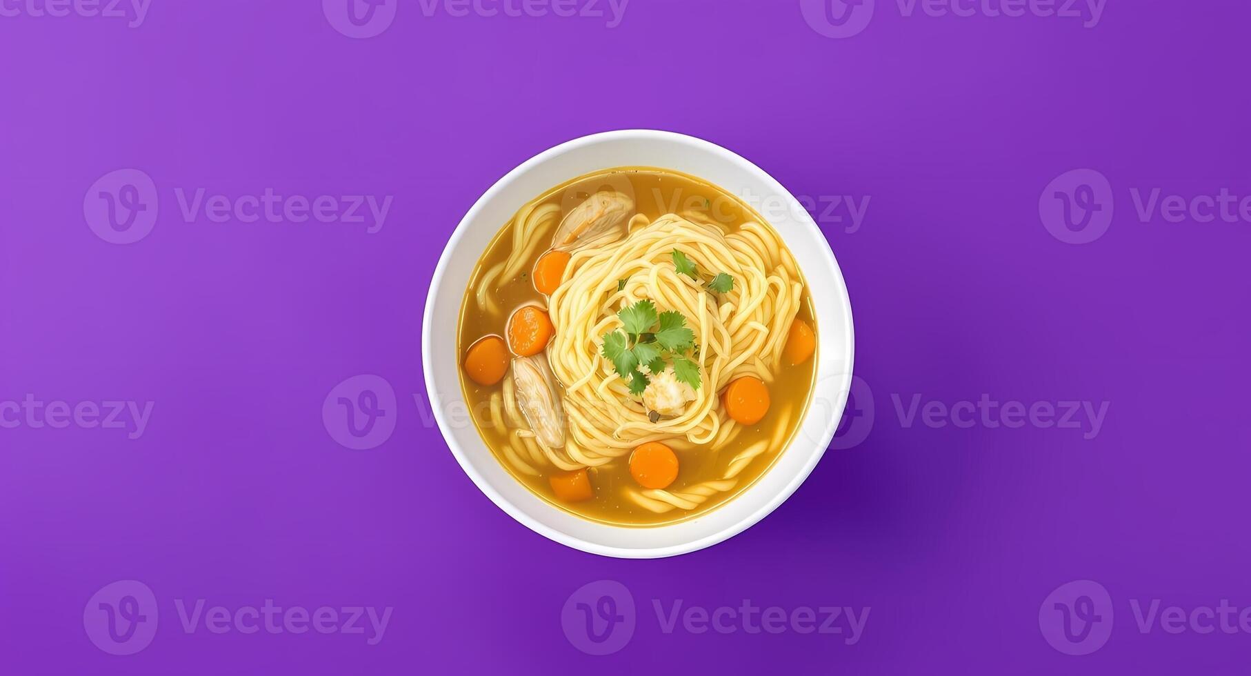 Noodle Soup Bowl with Carrots and Parsley on Purple Background photo