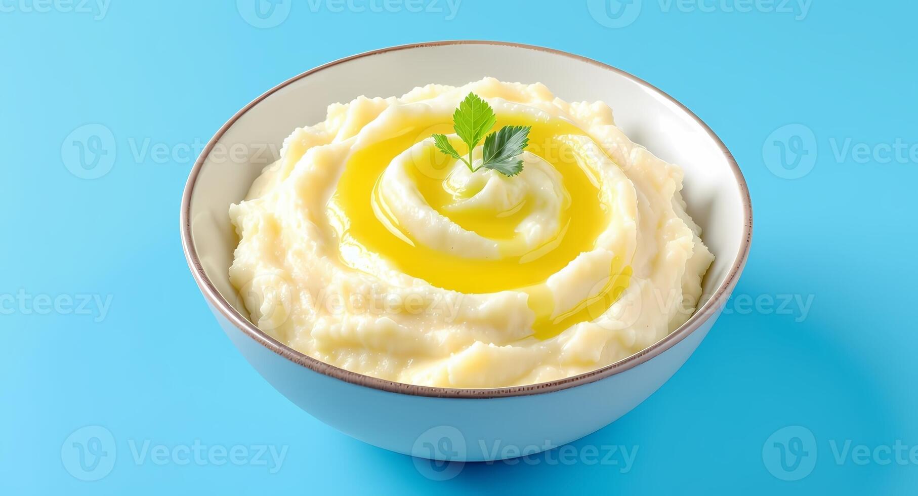 Mashed Potatoes in Bowl with Yellow Sauce and Parsley photo