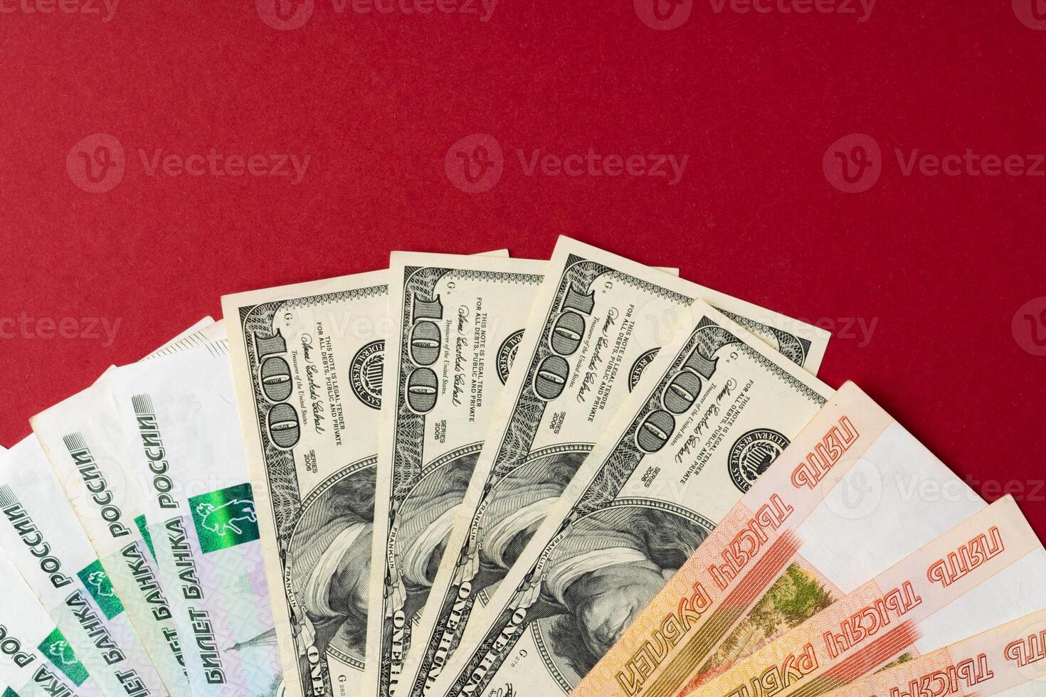 US Dollar and Russian Ruble banknotes close up photo