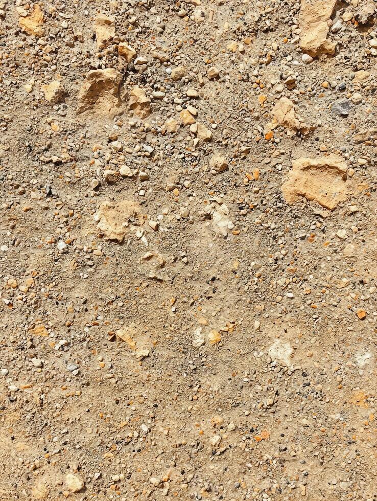 A Close Up Texture Depicting Ground Soil With Small Rocks photo