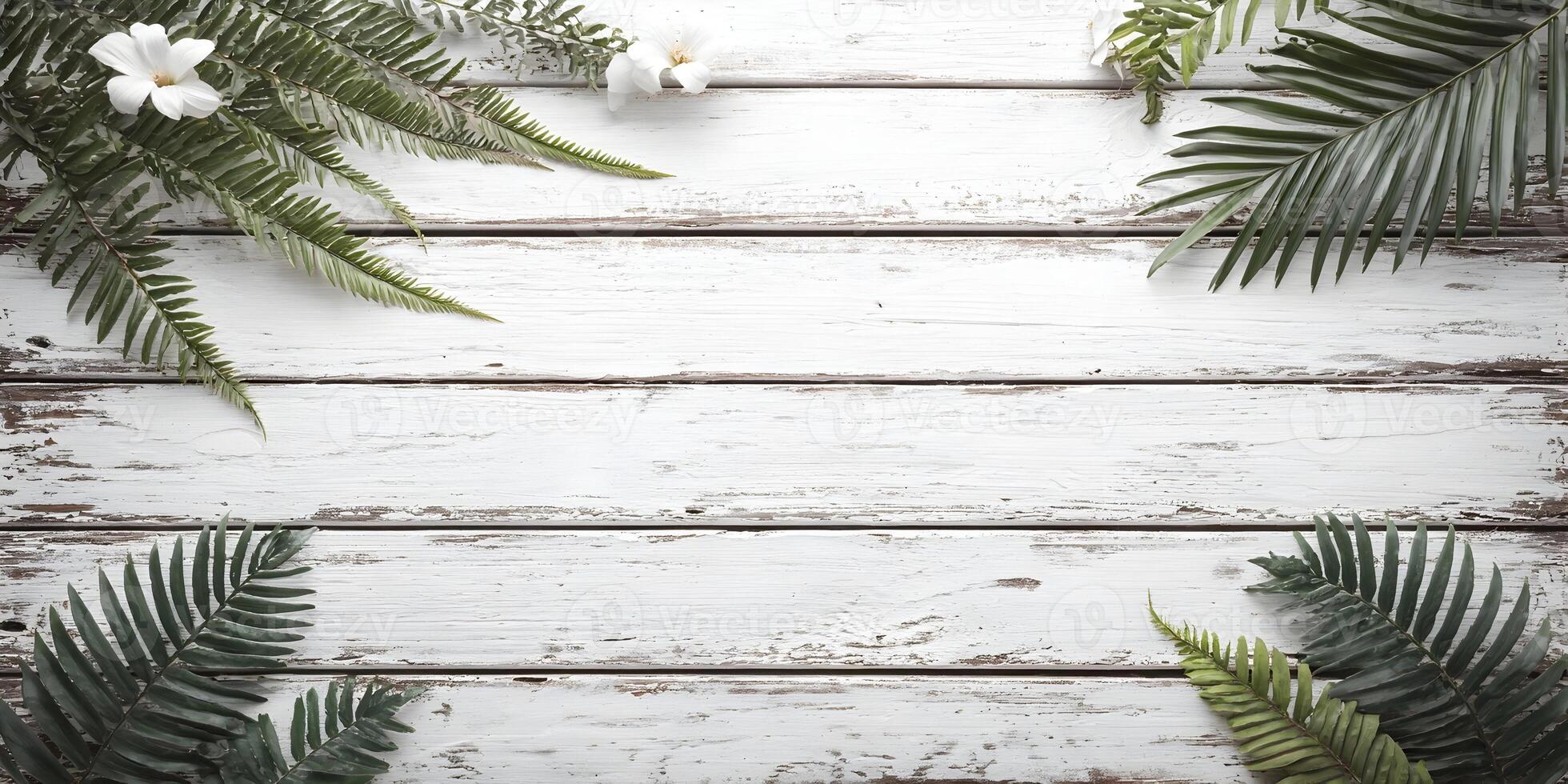 White Wooden Background with Tropical Leaves and Flowers photo